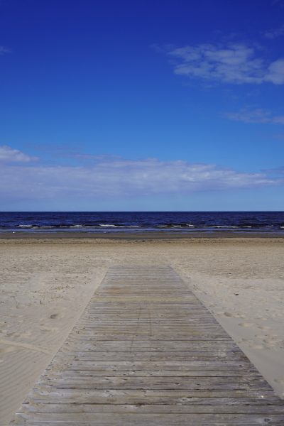 a wooden walkway on a beach
